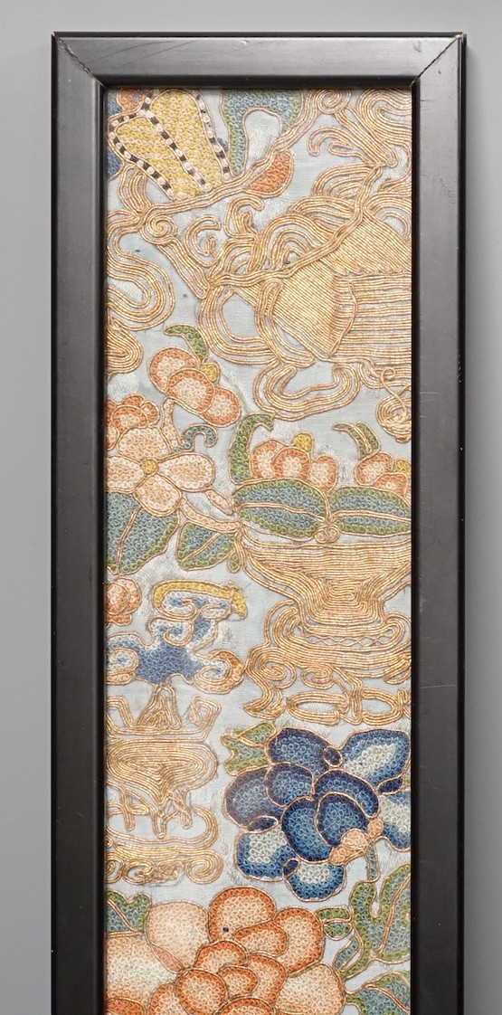 A Chinese framed embroidered floral panel - 53 x 8cm